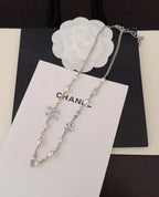 Chanel Jewelry | Pearl Strand with Integrated Crystal-Encrusted Logo