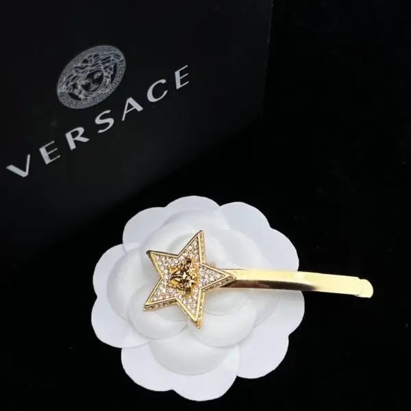 Versace Jewelry | Pavé Ball Pendant with Medusa Engraving