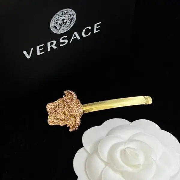 Versace Jewelry | Pavé Ball Pendant with Medusa Engraving