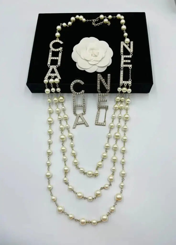 Chanel Jewelry | Turquoise Crystal CC Swirl Brooch Collection