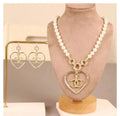 Chanel Jewelry | Square Pearl & Black Cabochon CC Drop Earrings