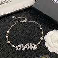 Chanel Jewelry | Pearl Strand with Integrated Crystal-Encrusted Logo