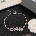 Chanel Jewelry | Pearl Strand with Integrated Crystal-Encrusted Logo